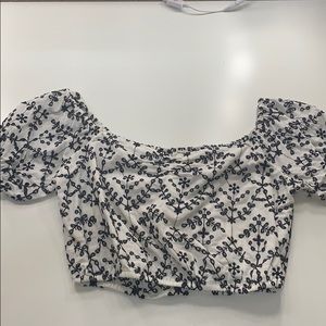 White crop top with black floral design